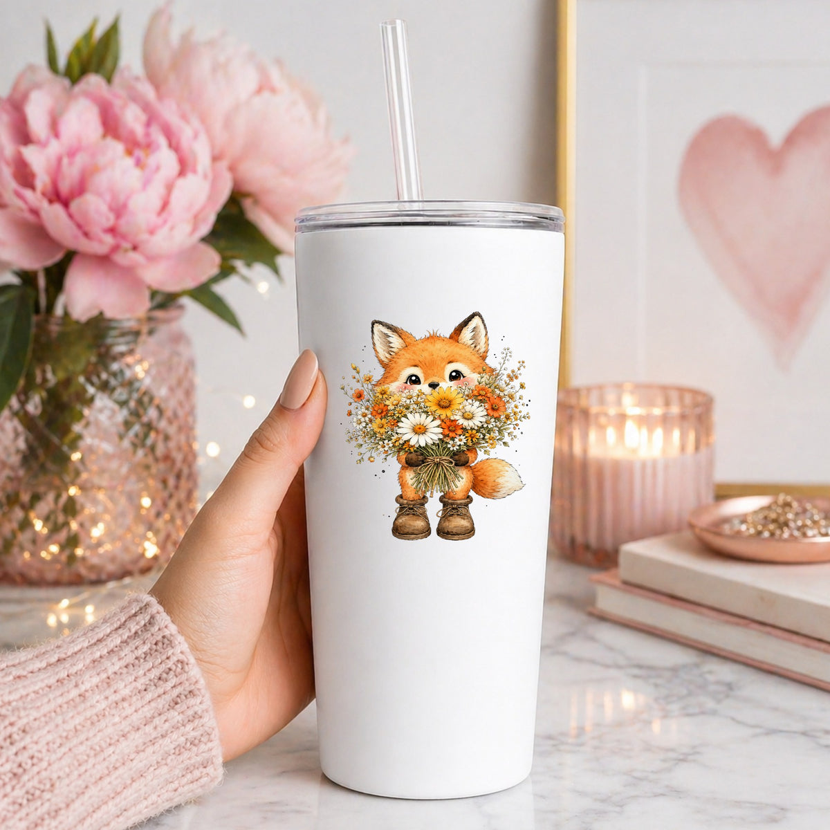 Watercolor Fox Holding Daisy Bouquet UV DTF sticker applied to a white straw tumbler beside pink peonies