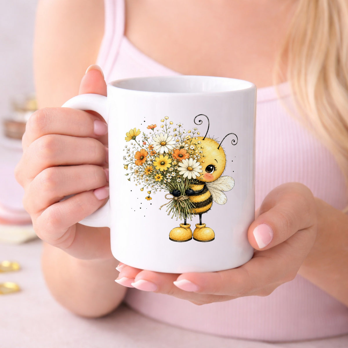 Honey Bee Holding Wildflower Bouquet UV DTF sticker applied to a white coffee mug held in both hands