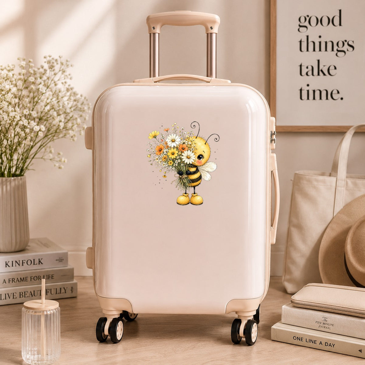 Honey Bee Holding Wildflower Bouquet UV DTF sticker applied to a cream carry-on suitcase