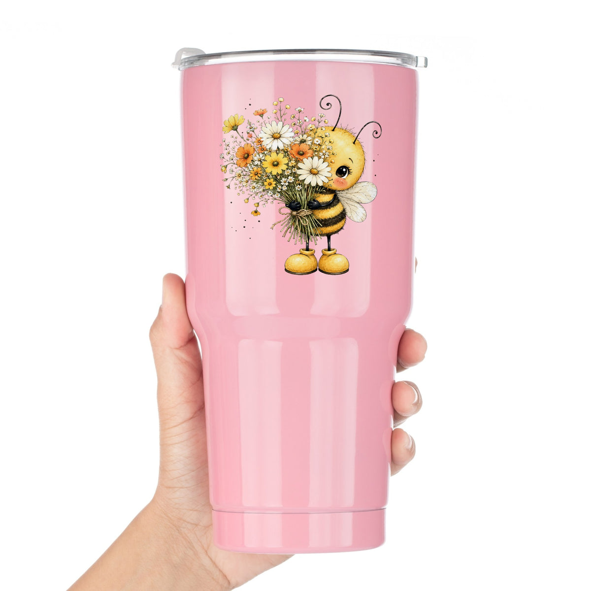 Honey Bee Holding Wildflower Bouquet UV DTF sticker applied to a pink tumbler held against a white background