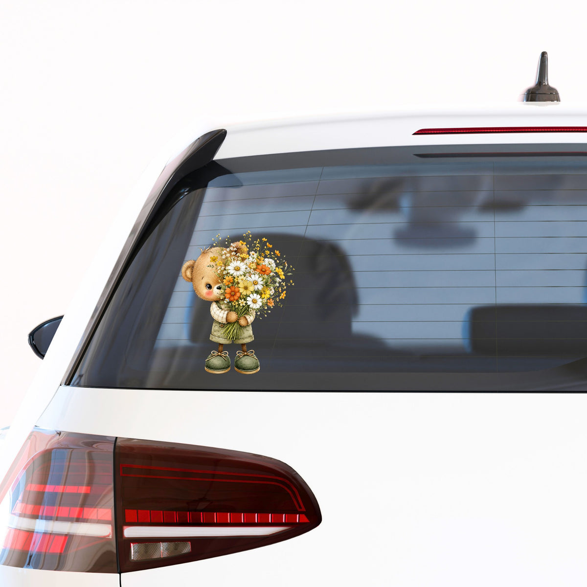 Brown Bear In Overalls Holding Daisy Bouquet UV DTF sticker applied to the rear window of a white car