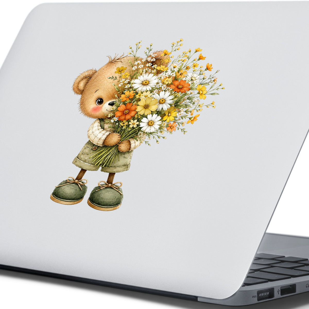 Brown Bear In Overalls Holding Daisy Bouquet UV DTF sticker applied to the lid of a silver laptop
