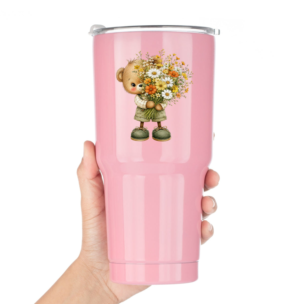 Brown Bear In Overalls Holding Daisy Bouquet UV DTF sticker applied to a pink tumbler held against a white background