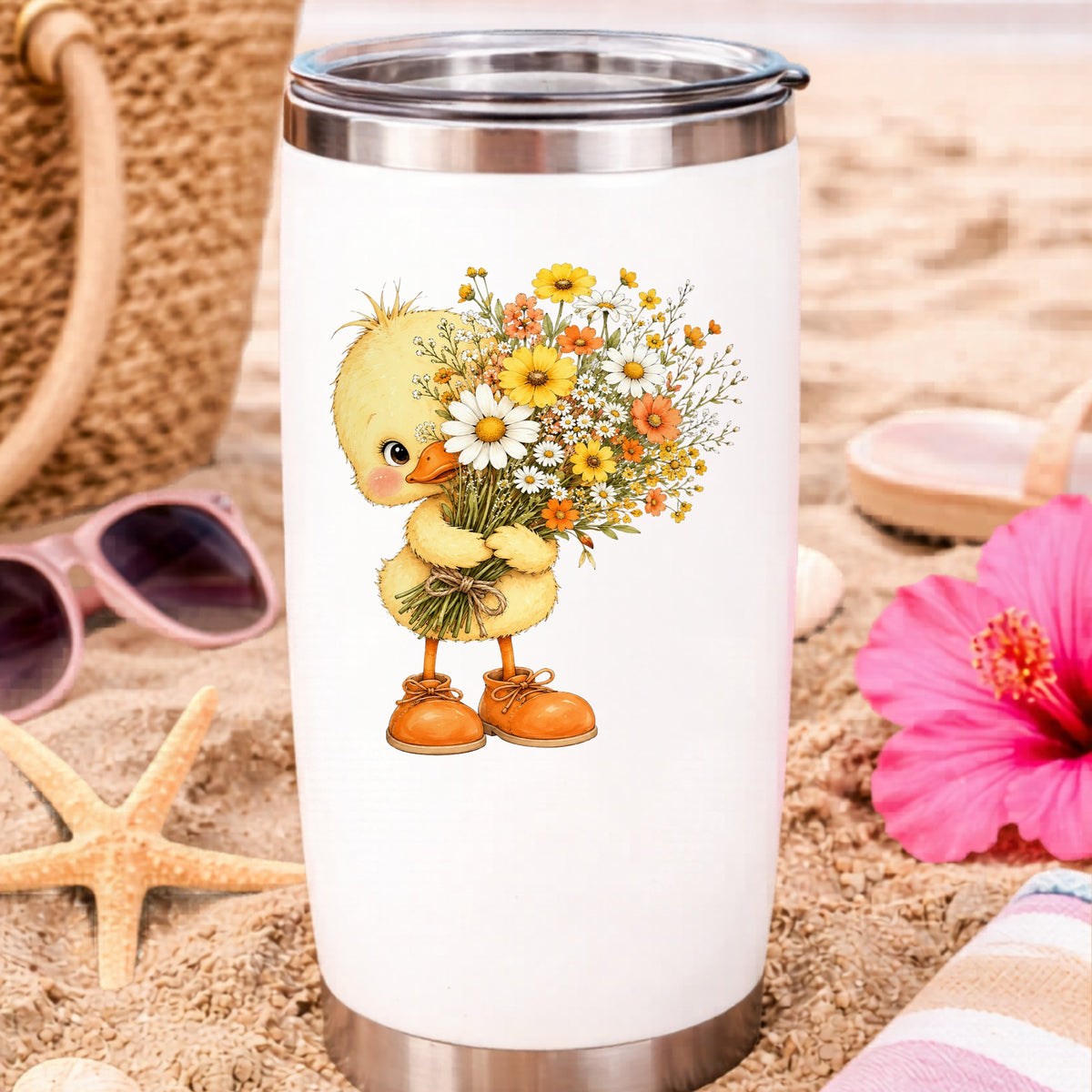 Baby Duck Holding Wildflower Bouquet UV DTF sticker applied to a white travel tumbler on beach sand