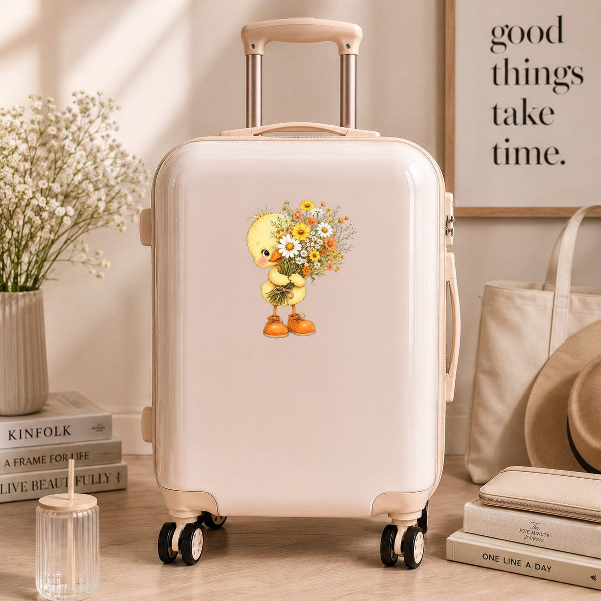 Baby Duck Holding Wildflower Bouquet UV DTF sticker applied to a cream carry-on suitcase