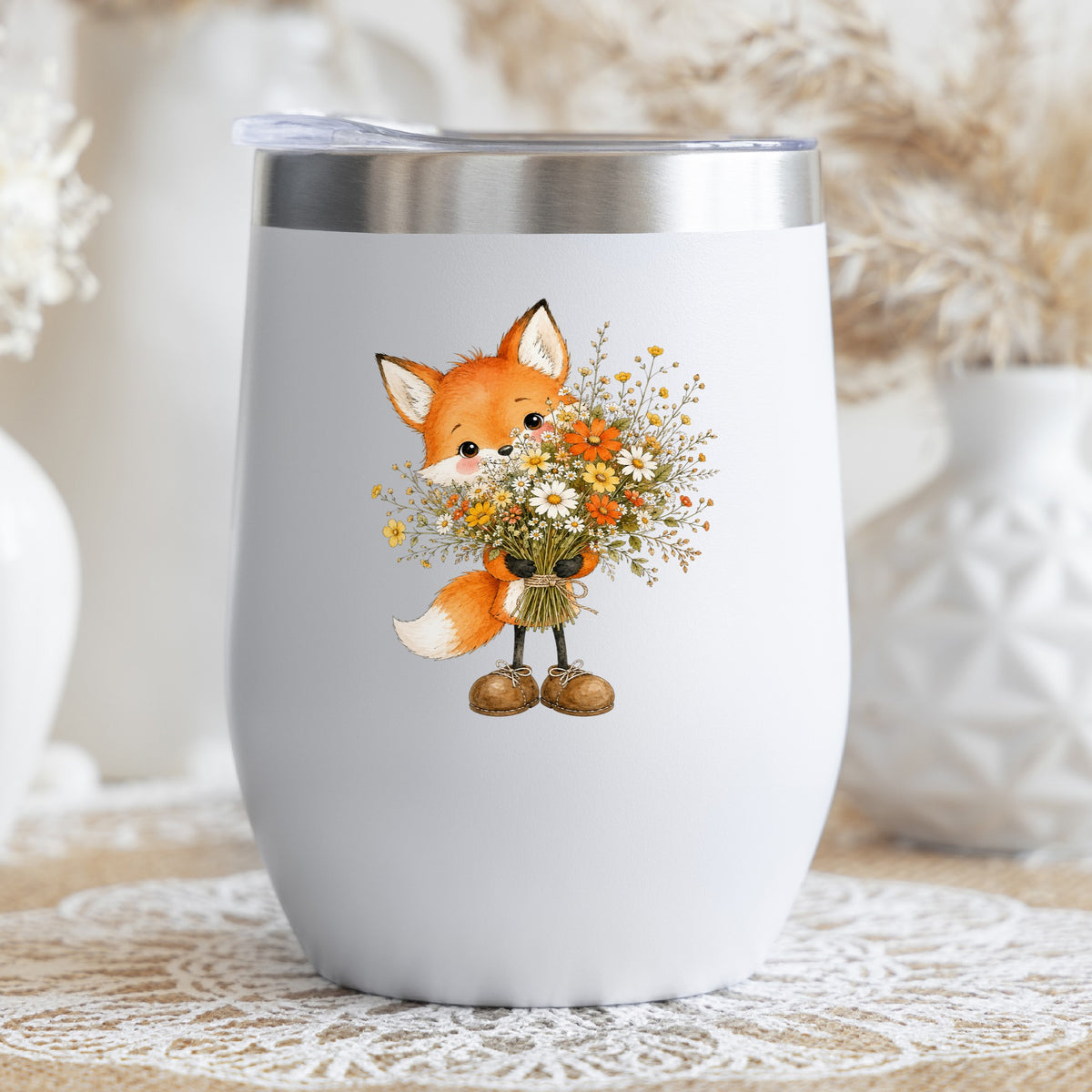 Orange Fox Holding Flower Bouquet UV DTF sticker applied to a white stemless tumbler with a lid