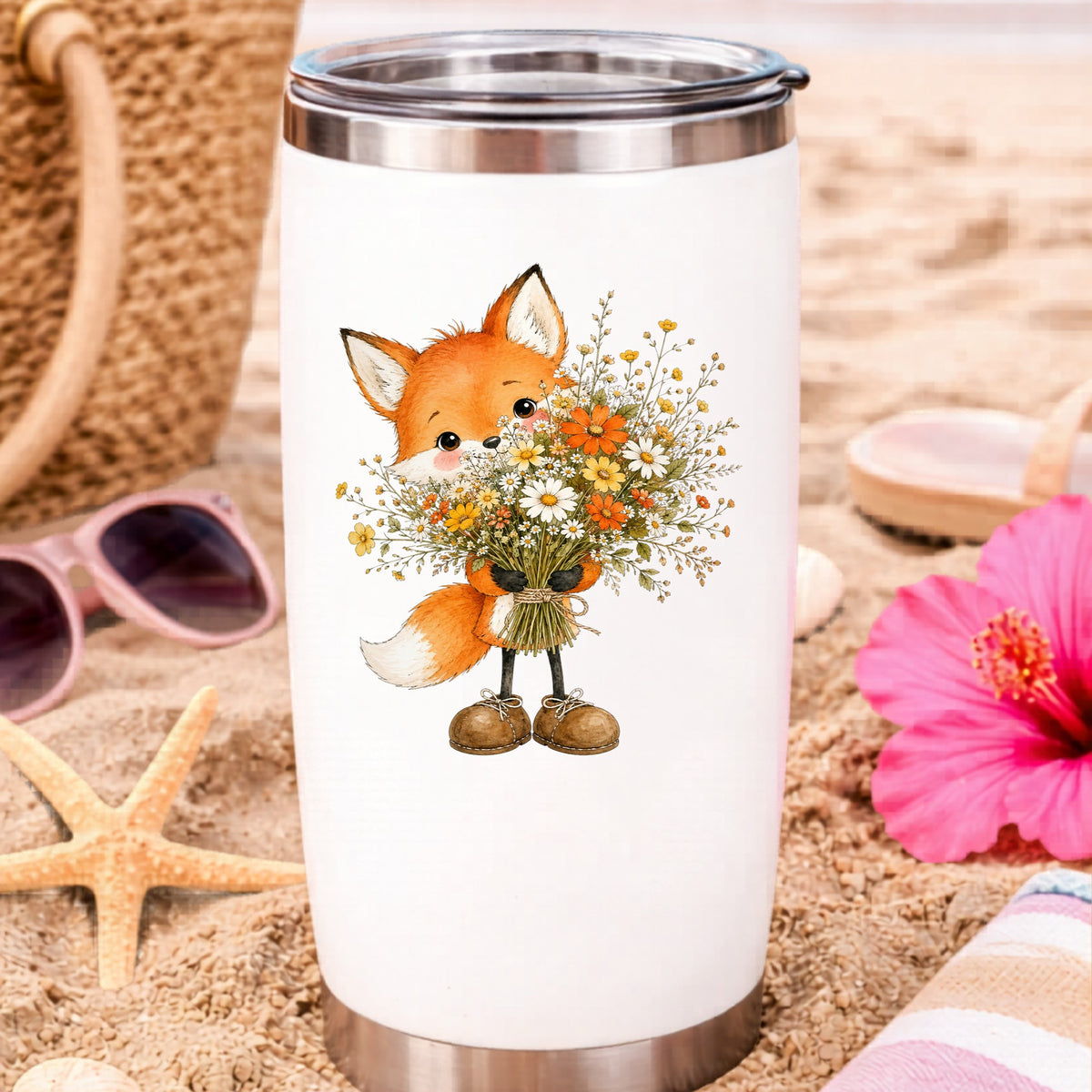 Orange Fox Holding Flower Bouquet UV DTF sticker applied to a white travel tumbler on beach sand