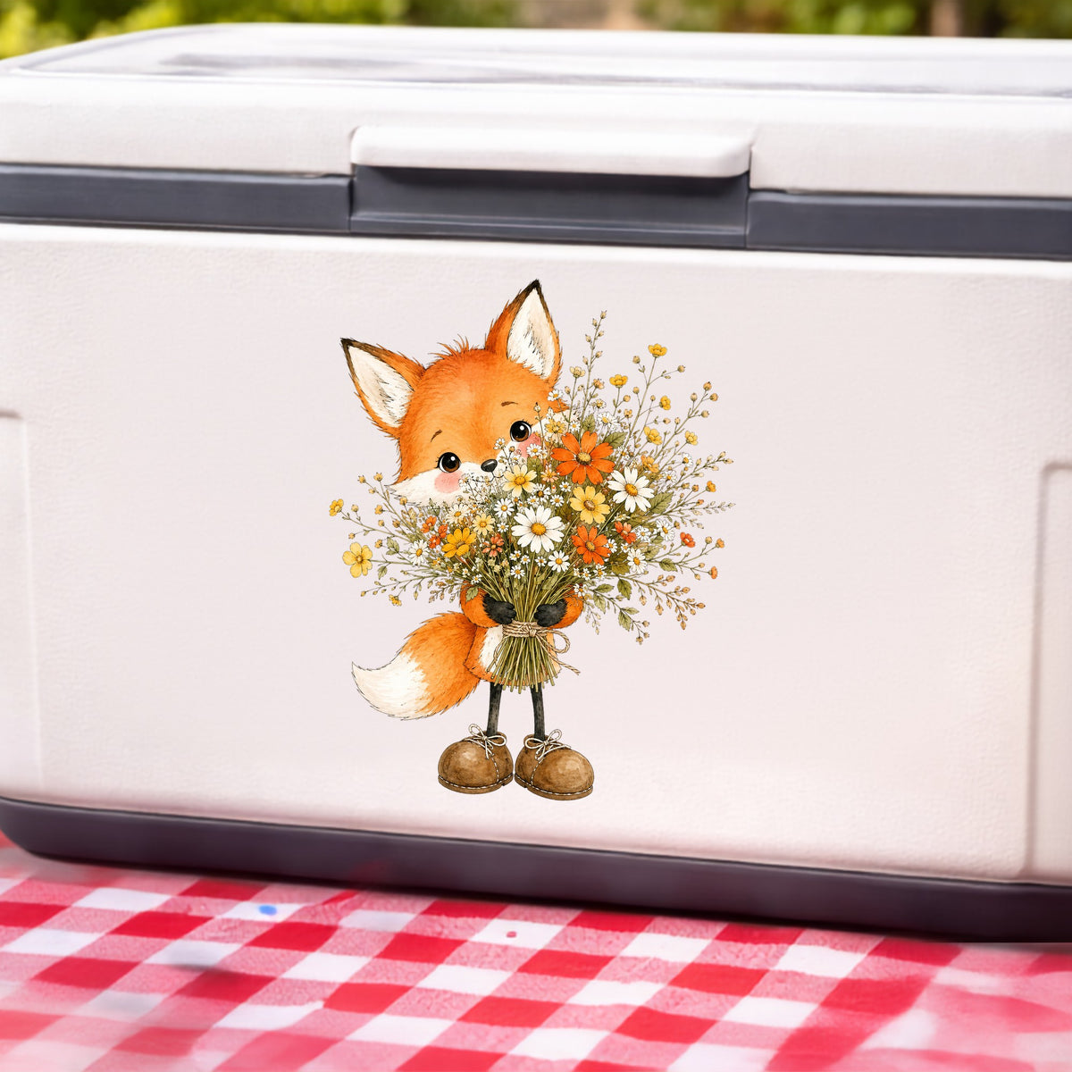 Orange Fox Holding Flower Bouquet UV DTF sticker applied to a white cooler on a red gingham cloth
