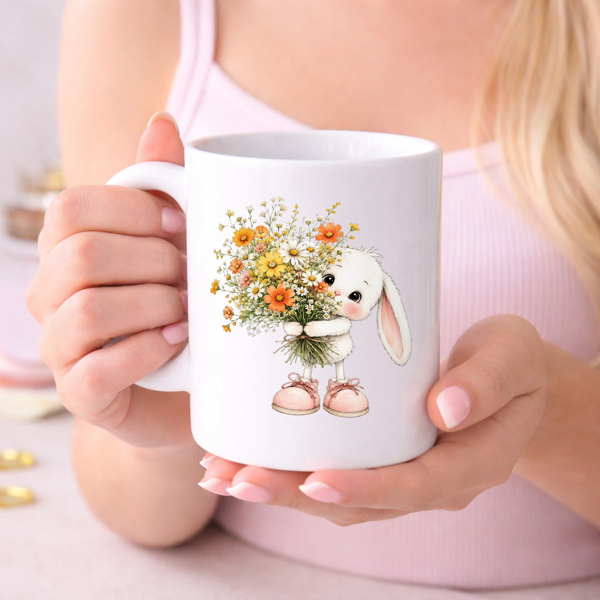 Baby Bunny Holding Daisy Bouquet UV DTF sticker applied to a white coffee mug held in both hands