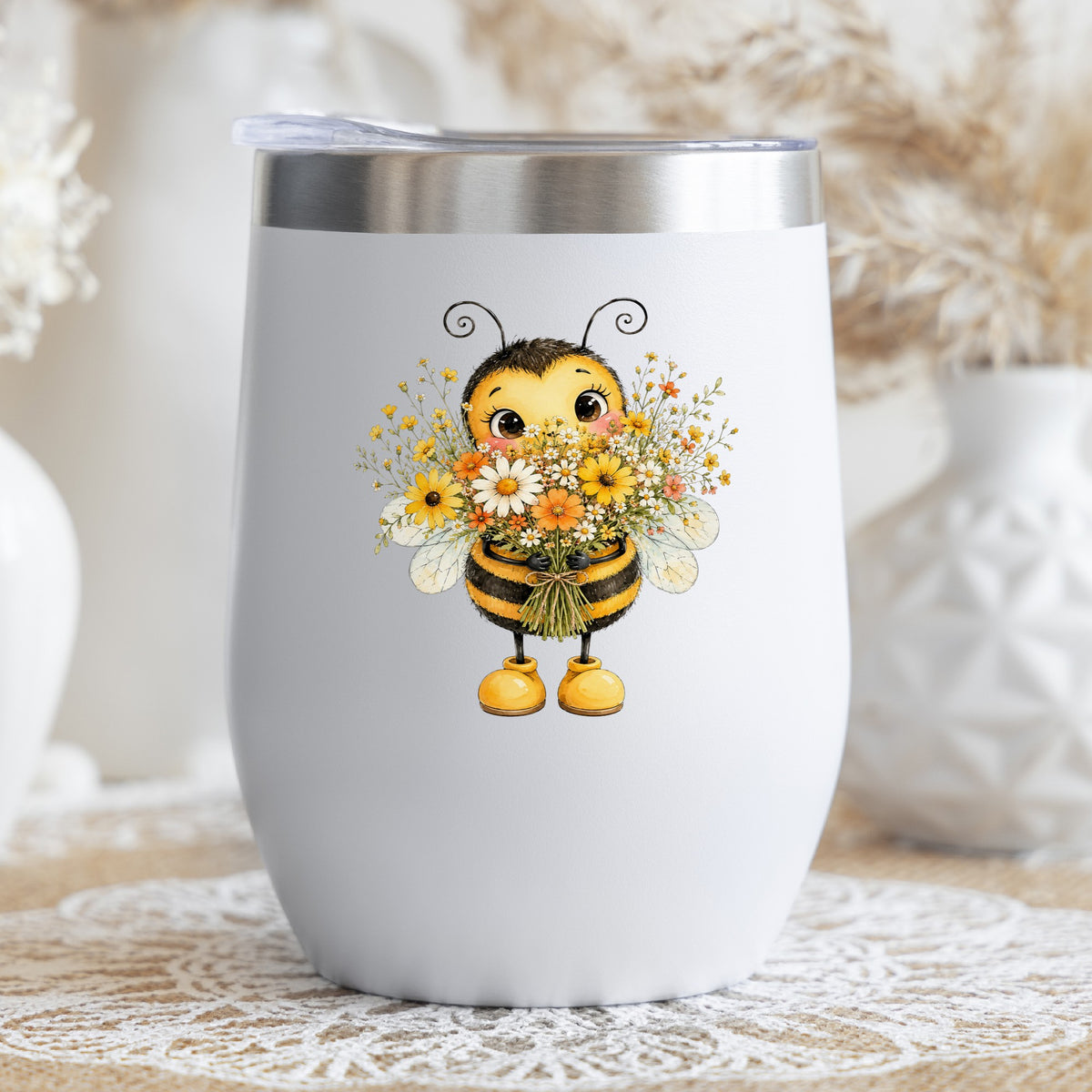 Bumble Bee Holding Daisy Bouquet UV DTF sticker applied to a white stemless tumbler with a lid