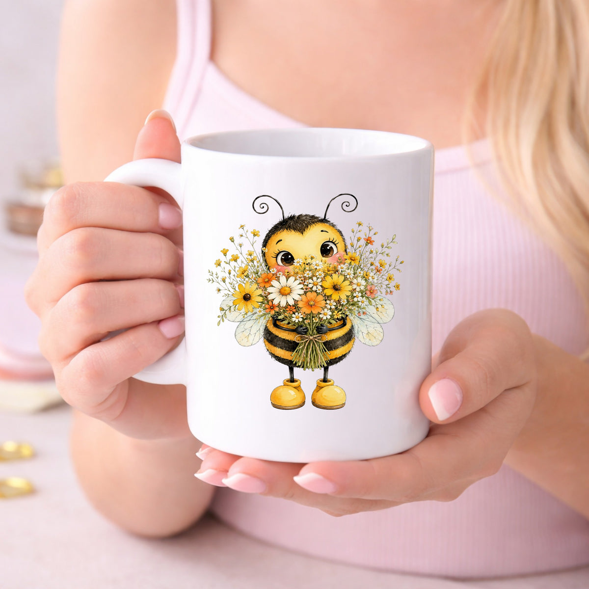 Bumble Bee Holding Daisy Bouquet UV DTF sticker applied to a white coffee mug held in both hands