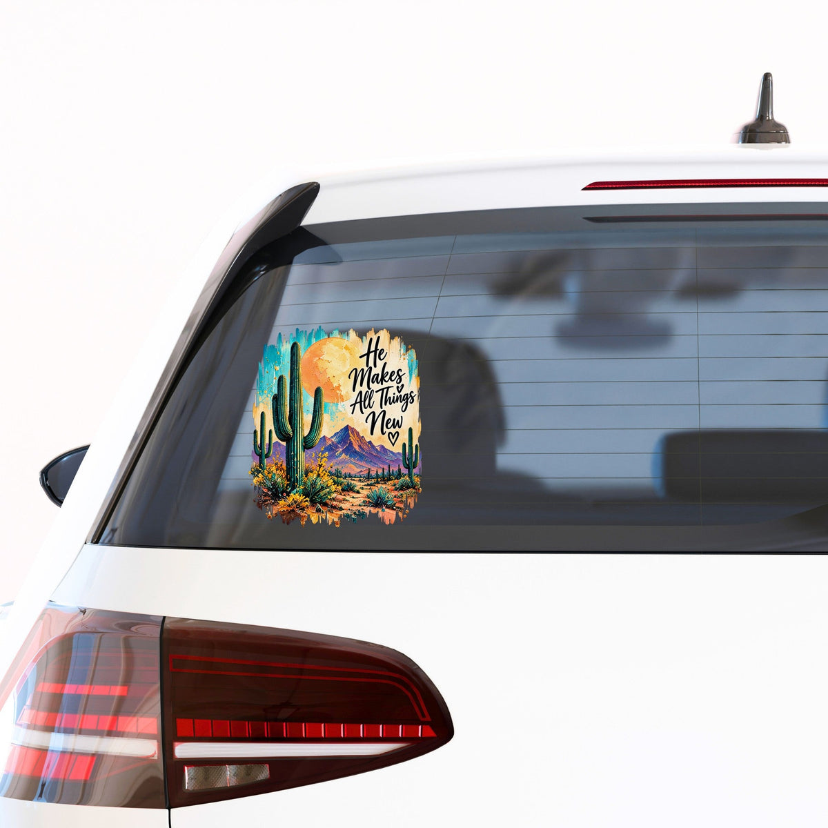 He Makes All Things New desert cactus UV DTF sticker on a car window