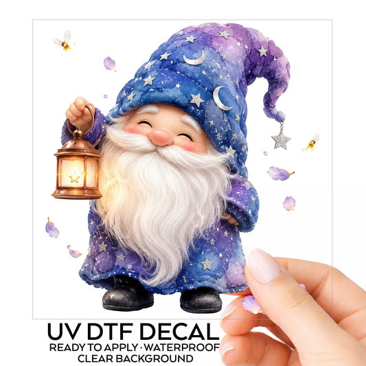 Gnome Holding A Lantern UV DTF sticker on its backing card, held in hand