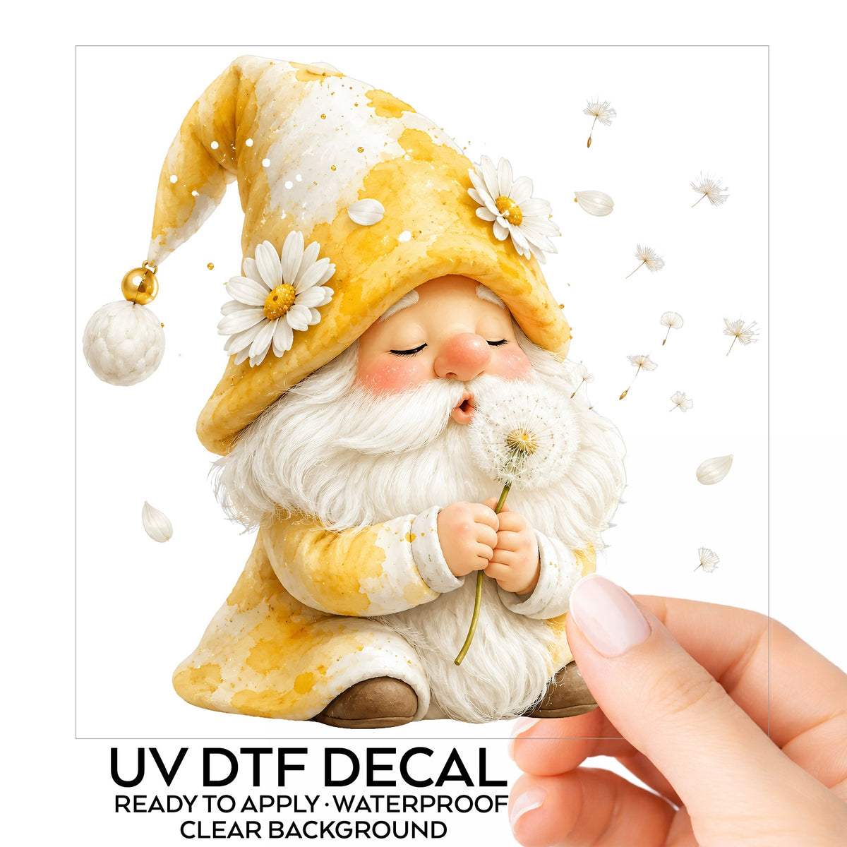 Gnome Blowing A Dandelion UV DTF sticker on its backing card, held in hand