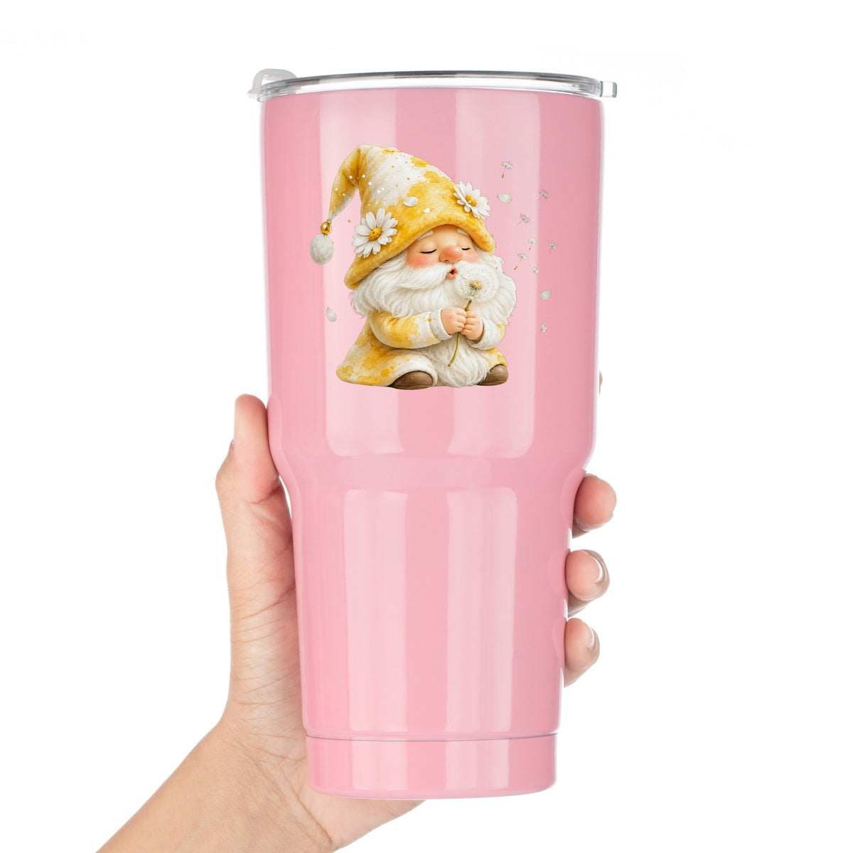 Gnome Blowing A Dandelion UV DTF sticker applied to a pink tumbler held against a white background