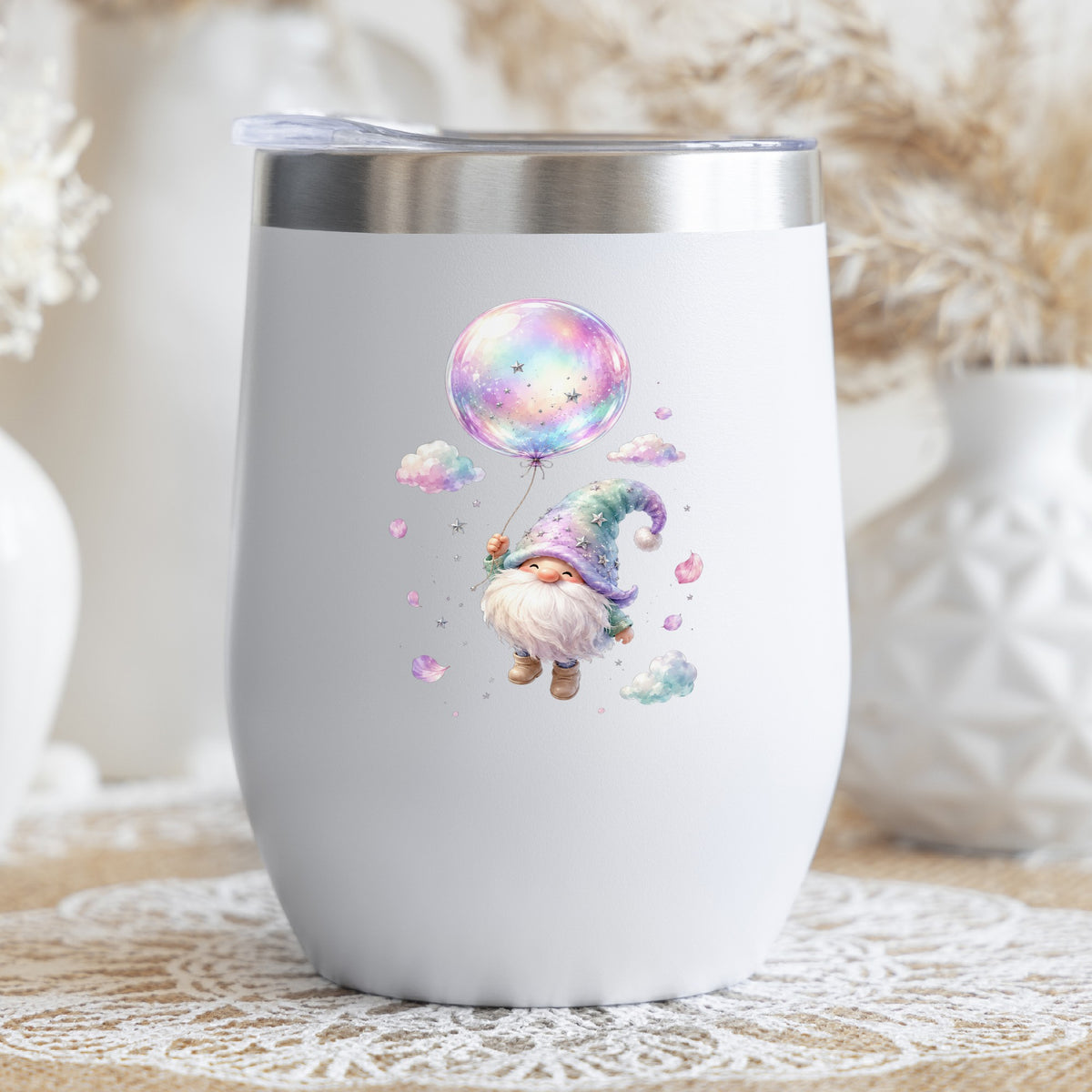 Gnome With Rainbow Bubble Balloon UV DTF sticker applied to a white stemless tumbler with a lid