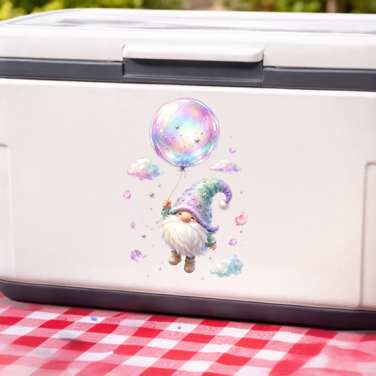 Gnome With Rainbow Bubble Balloon UV DTF sticker applied to a white cooler on a red gingham cloth