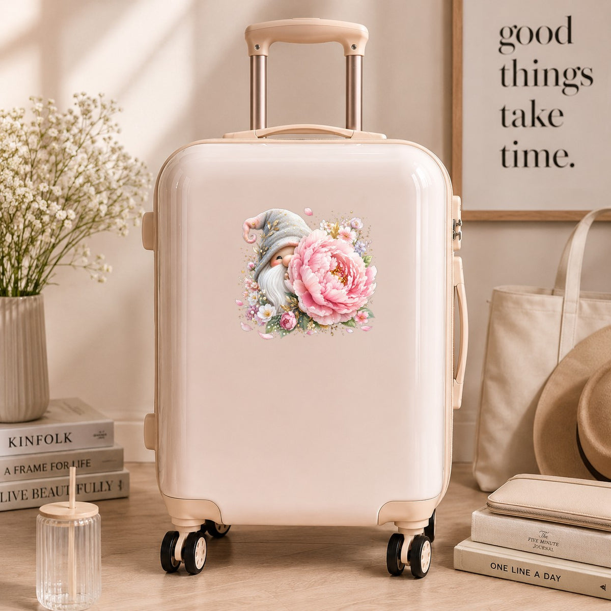 Gnome With Pink Peony UV DTF sticker applied to a cream carry-on suitcase