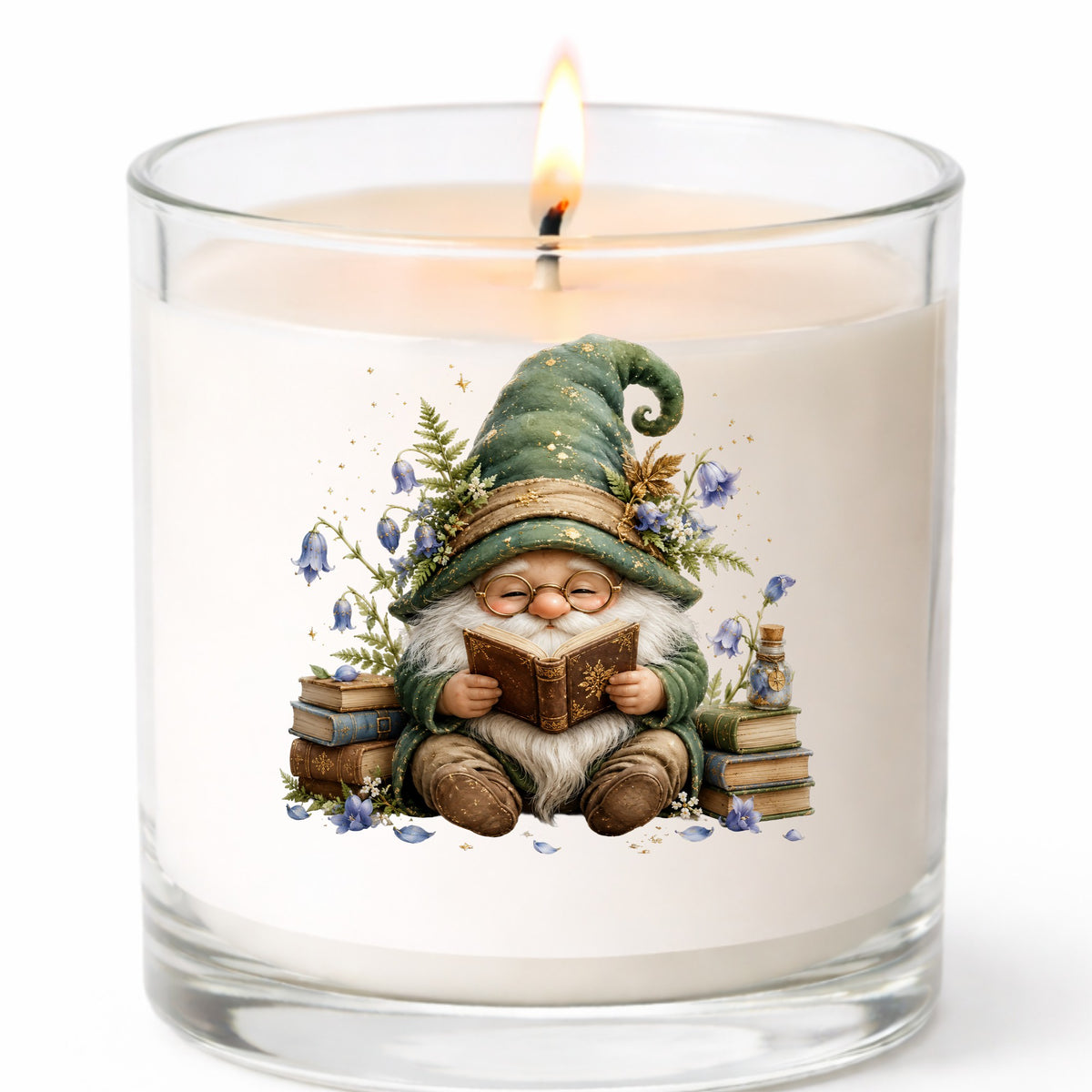Gnome Reading With Book Stack UV DTF sticker applied to a white candle in a clear glass jar