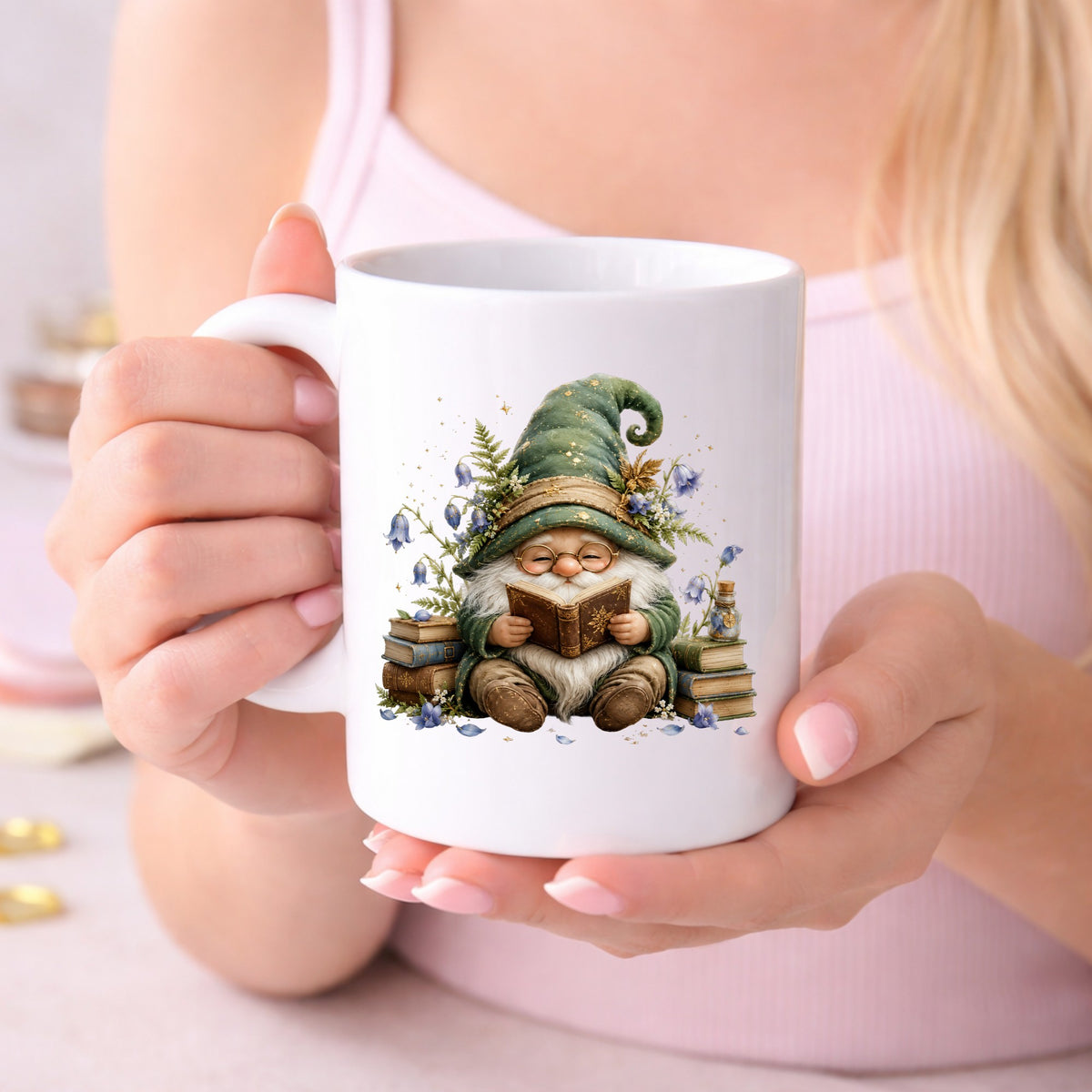 Gnome Reading With Book Stack UV DTF sticker applied to a white coffee mug held in both hands