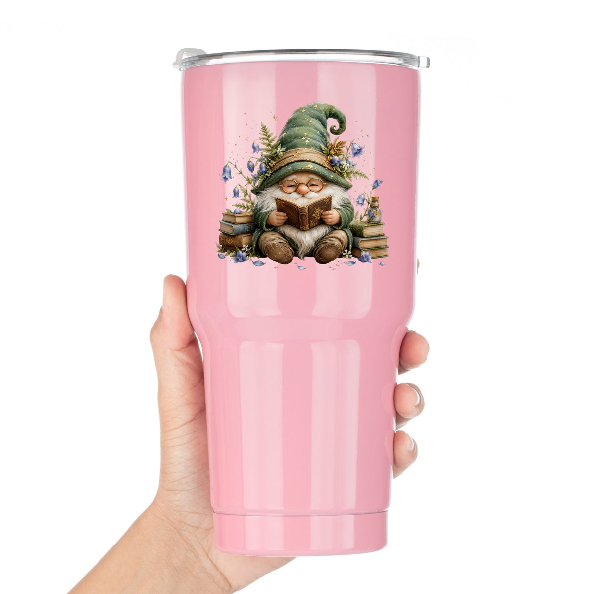 Gnome Reading With Book Stack UV DTF sticker applied to a pink tumbler held against a white background