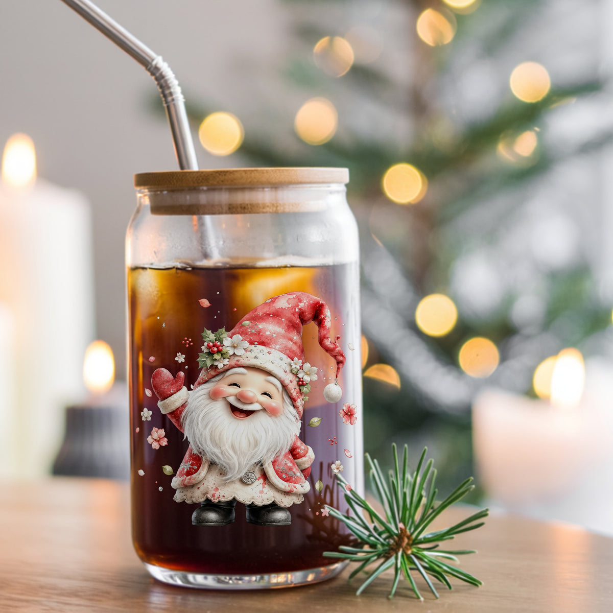 Red Christmas Gnome UV DTF sticker applied to a glass can cup of iced coffee with a straw