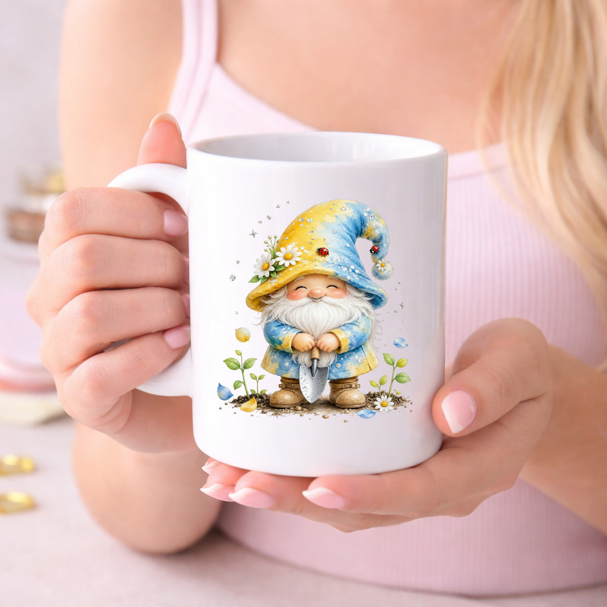 Gardening Gnome With Trowel UV DTF sticker applied to a white coffee mug held in both hands