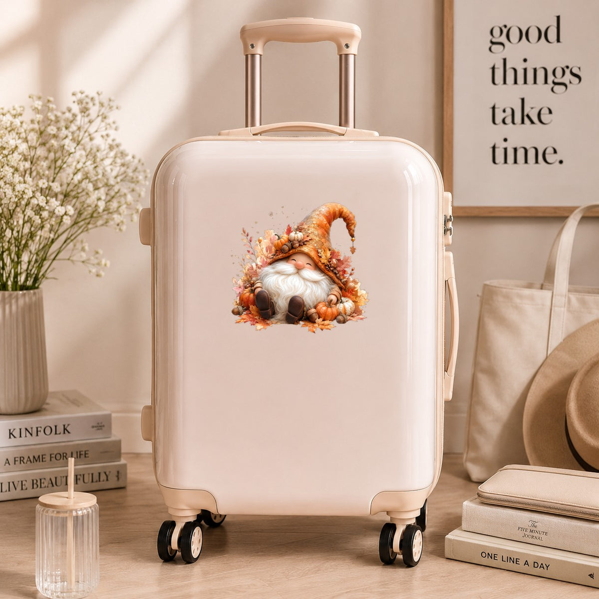 Autumn Gnome With Pumpkins UV DTF sticker applied to a cream carry-on suitcase