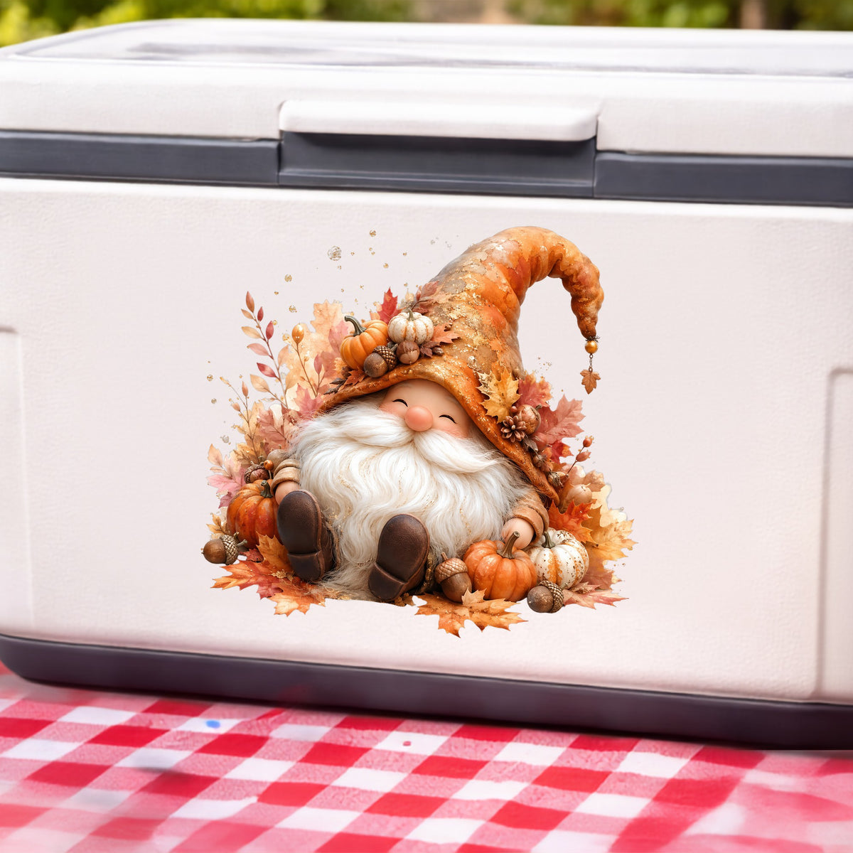 Autumn Gnome With Pumpkins UV DTF sticker applied to a white cooler on a red gingham cloth