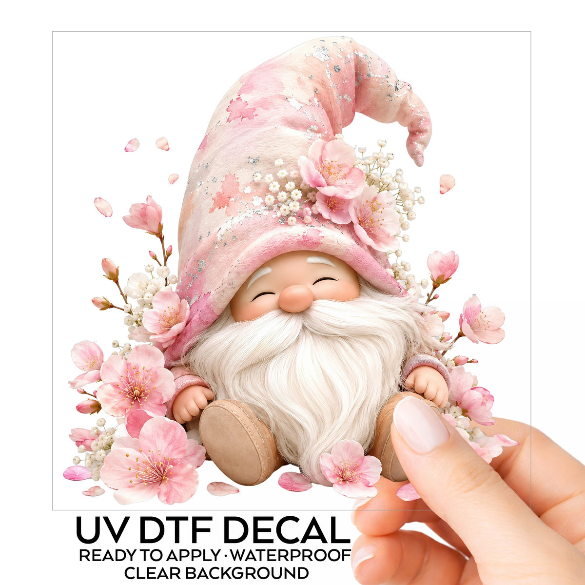 Cherry Blossom Gnome UV DTF sticker on its backing card, held in hand