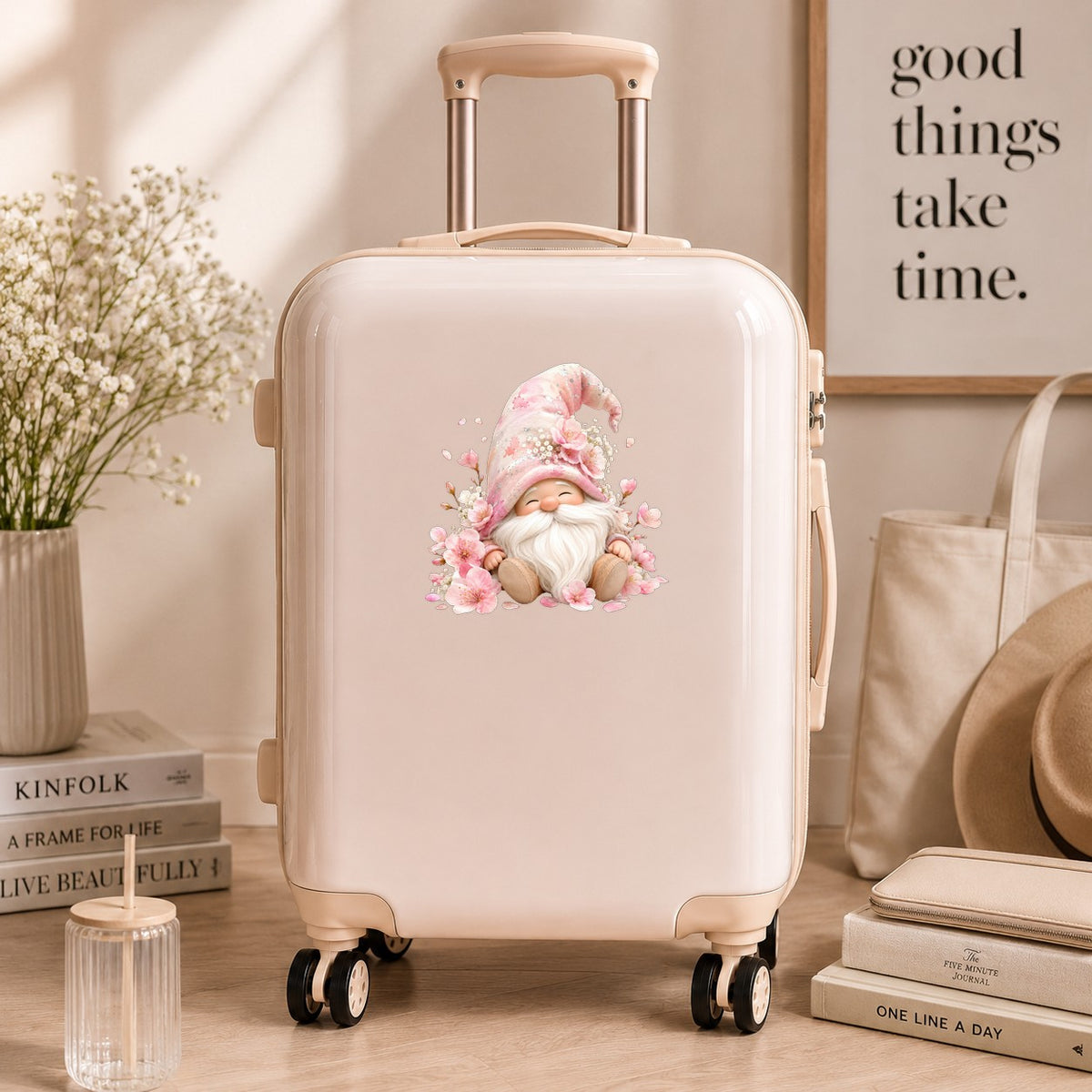 Cherry Blossom Gnome UV DTF sticker applied to a cream carry-on suitcase