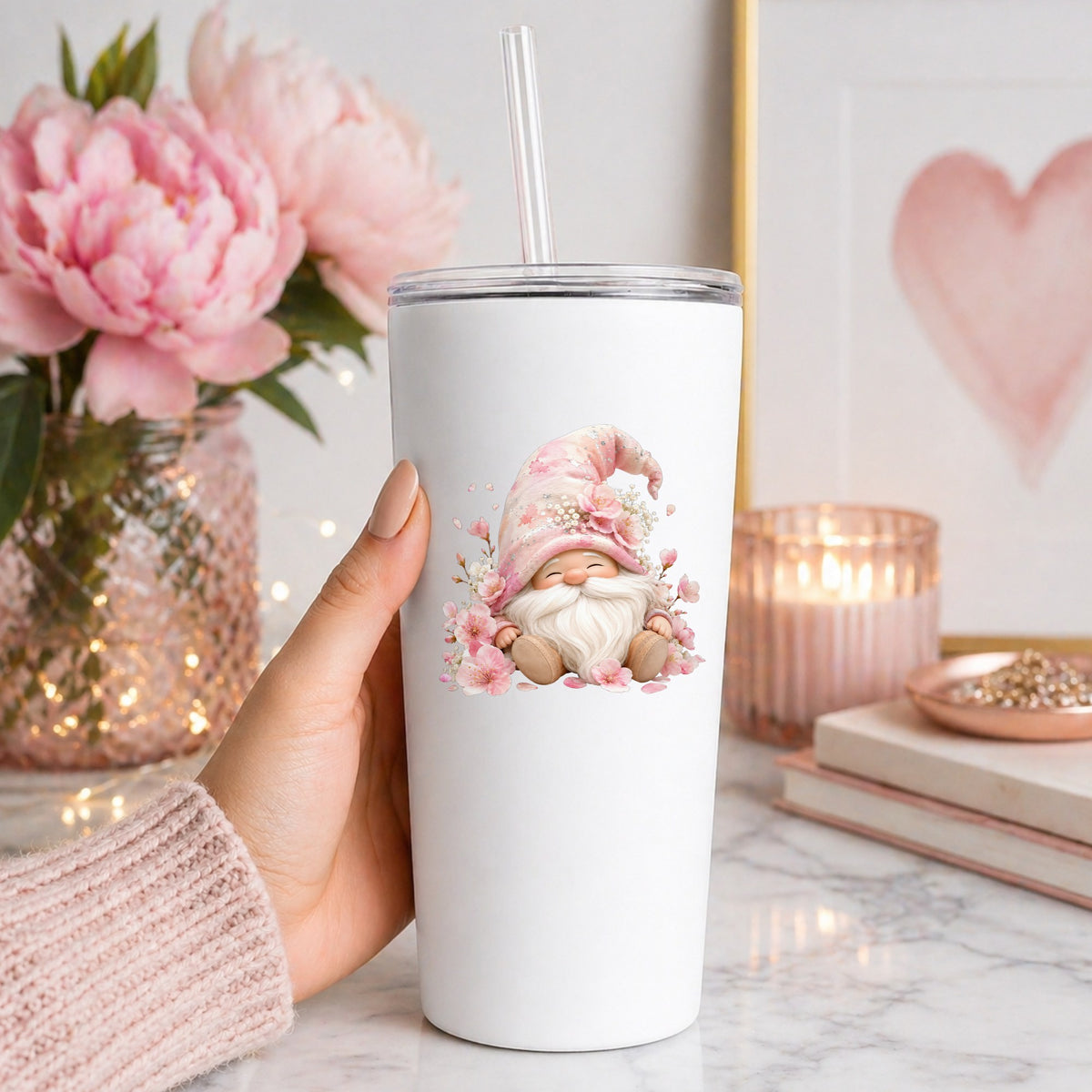 Cherry Blossom Gnome UV DTF sticker applied to a white straw tumbler beside pink peonies