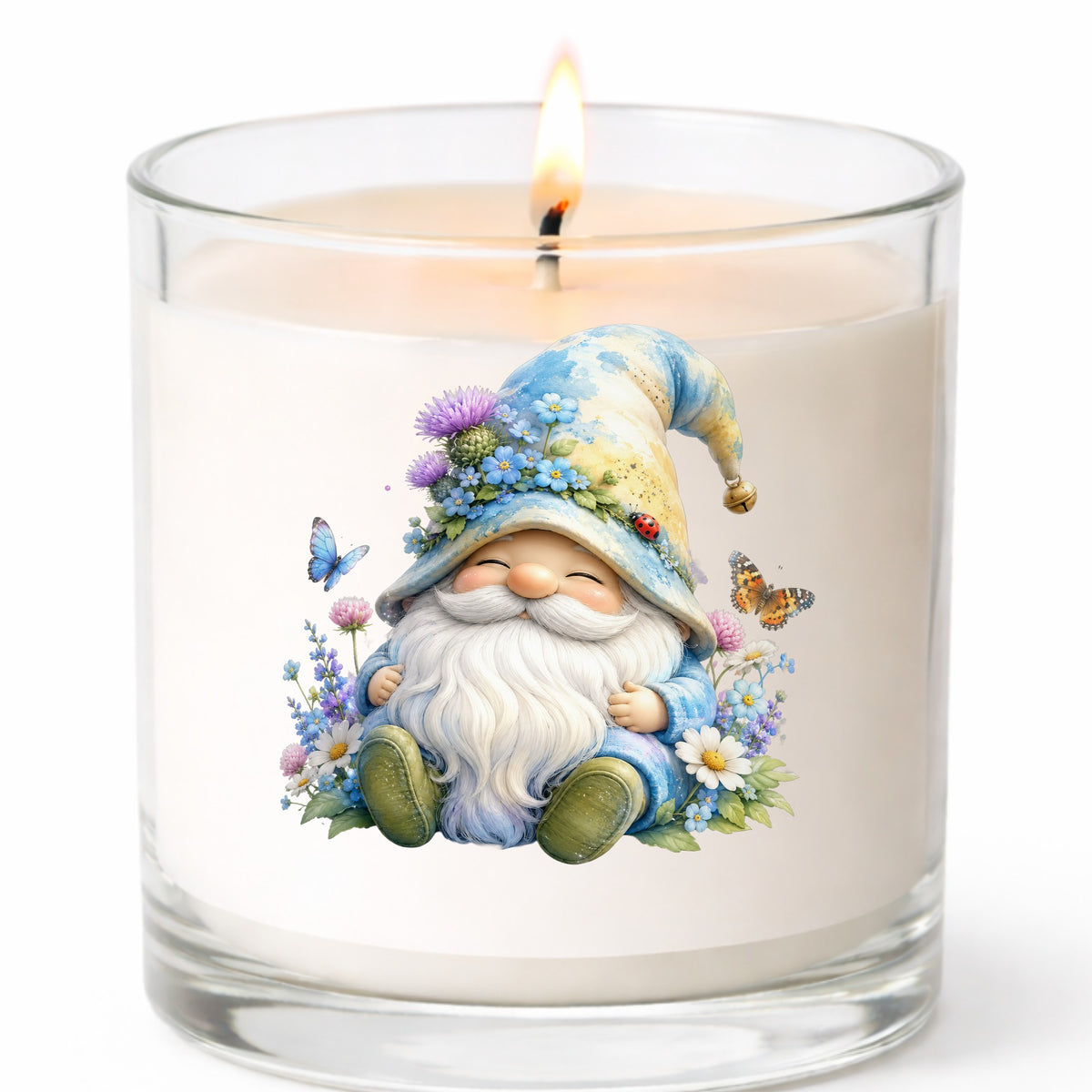 Wildflower Gnome With Butterflies UV DTF sticker applied to a white candle in a clear glass jar