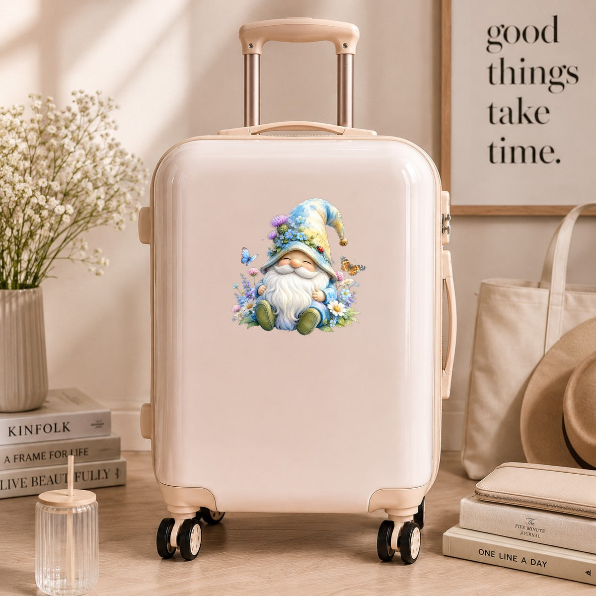 Wildflower Gnome With Butterflies UV DTF sticker applied to a cream carry-on suitcase
