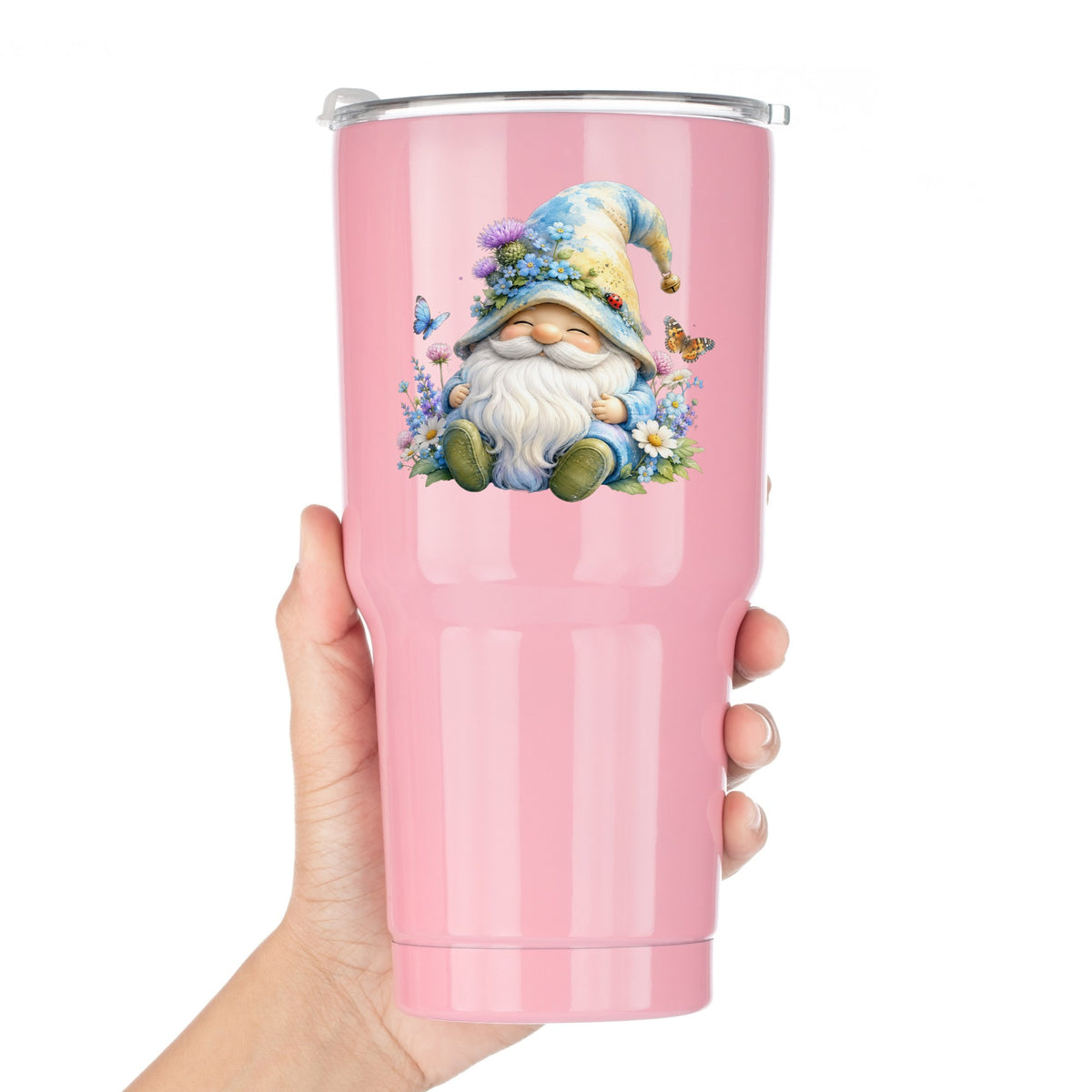 Wildflower Gnome With Butterflies UV DTF sticker applied to a pink tumbler held against a white background