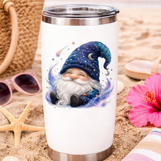 Celestial Starry Night Gnome UV DTF sticker applied to a white travel tumbler on beach sand