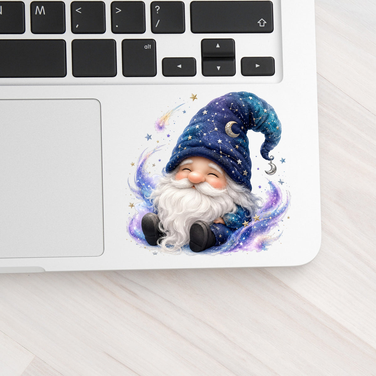 Celestial Starry Night Gnome UV DTF sticker applied to a silver laptop beside the keyboard