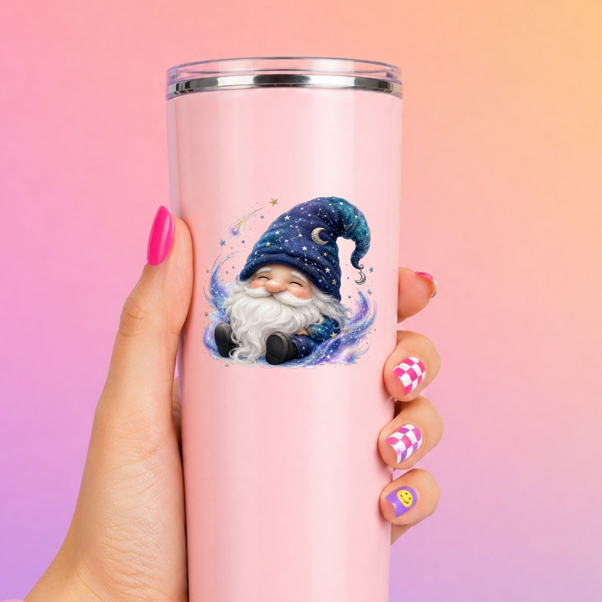 Celestial Starry Night Gnome UV DTF sticker applied to a tall pink tumbler on a pink and orange background