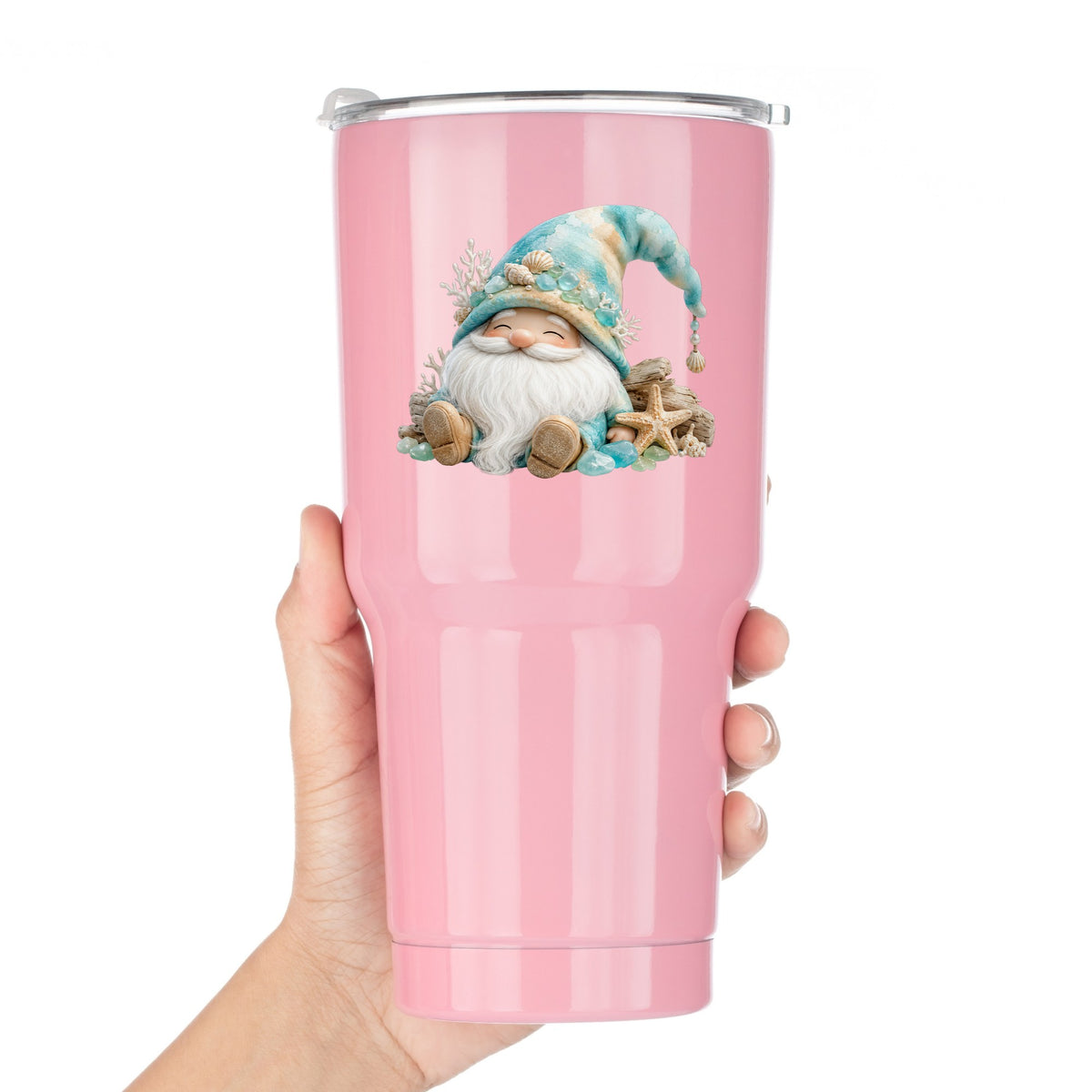 Beach Gnome With Seashells UV DTF sticker applied to a pink tumbler held against a white background