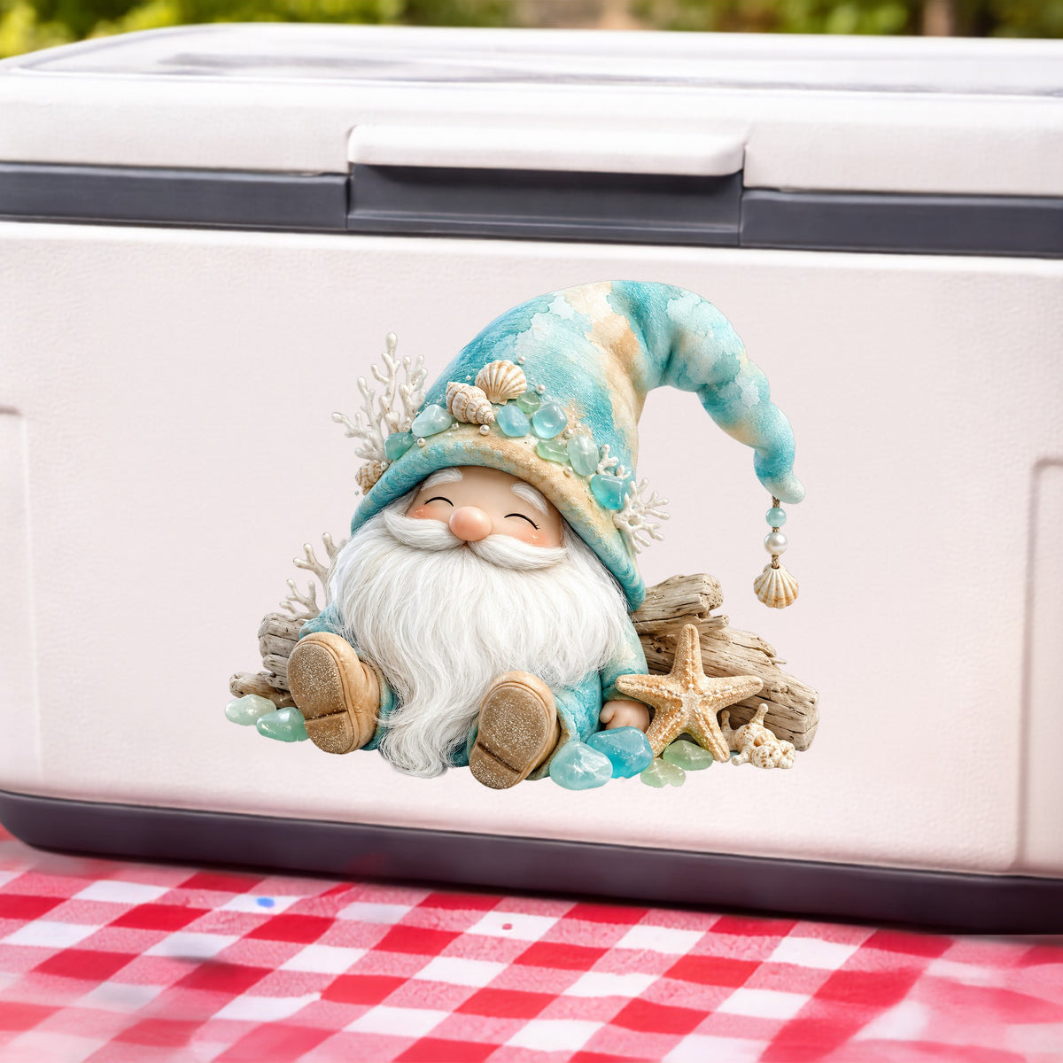 Beach Gnome With Seashells UV DTF sticker applied to a white cooler on a red gingham cloth