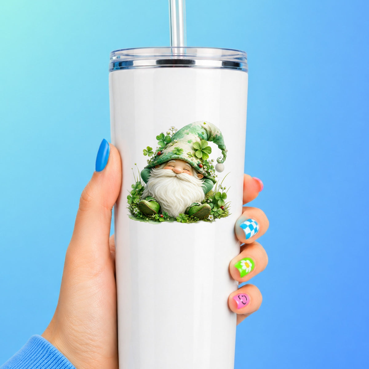 Shamrock Clover Gnome UV DTF sticker applied to a white straw tumbler on a blue background