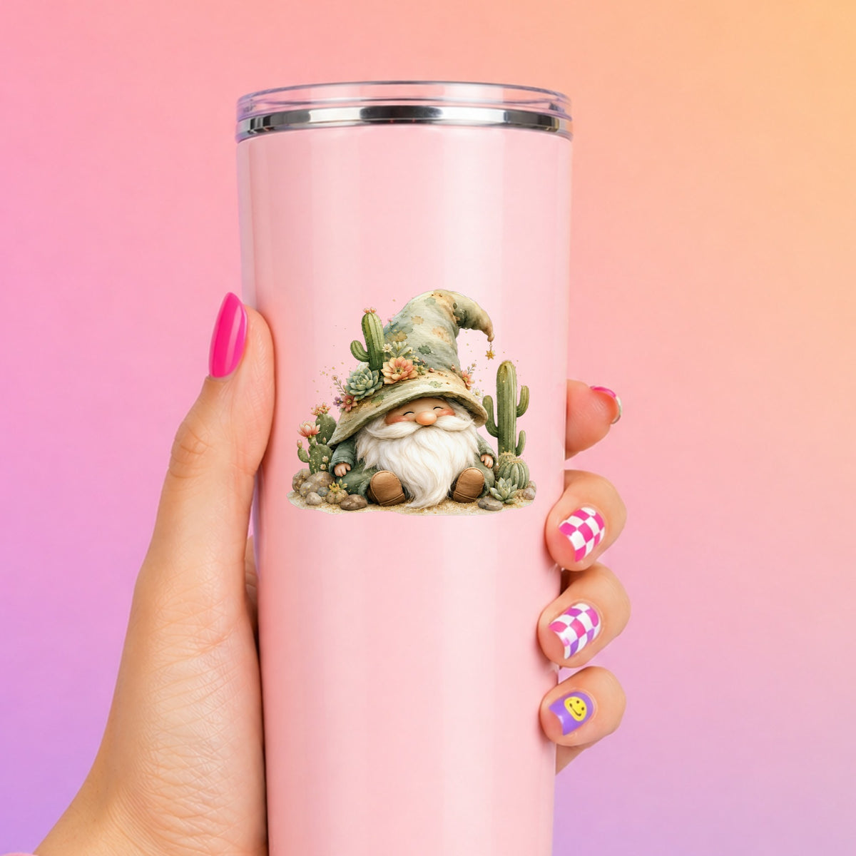 Cactus Succulent Gnome UV DTF sticker applied to a tall pink tumbler on a pink and orange background
