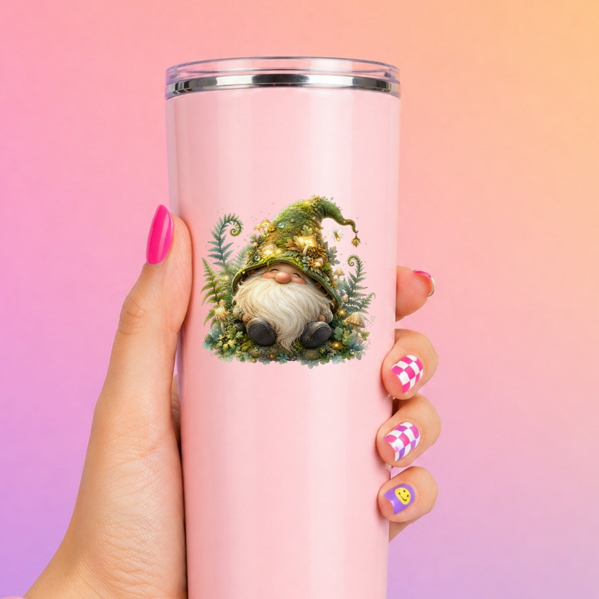 Mossy Forest Gnome UV DTF sticker applied to a tall pink tumbler on a pink and orange background