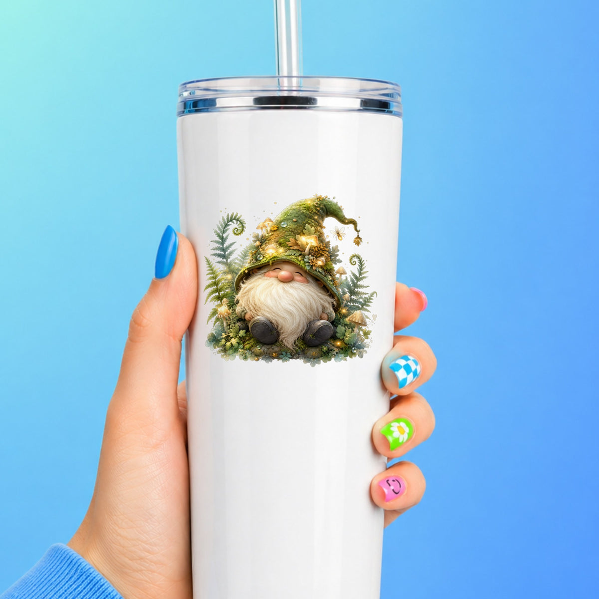 Mossy Forest Gnome UV DTF sticker applied to a white straw tumbler on a blue background