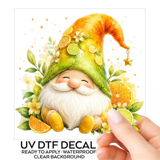 Citrus Gnome With Orange Slices UV DTF sticker on its backing card, held in hand