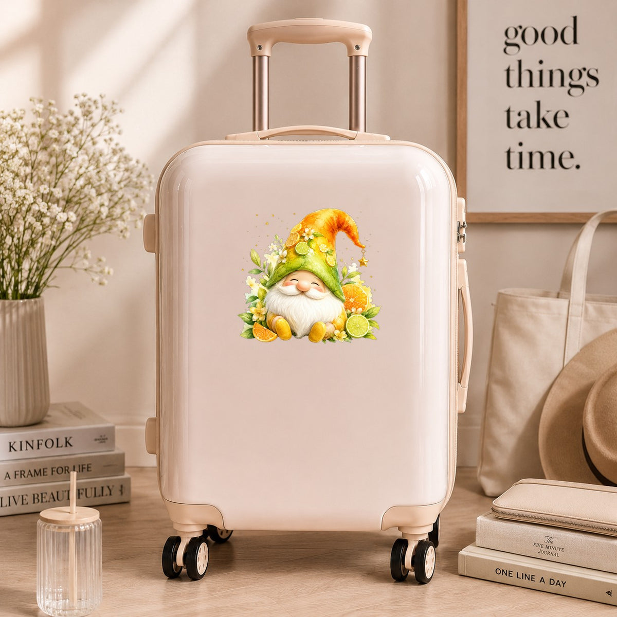 Citrus Gnome With Orange Slices UV DTF sticker applied to a cream carry-on suitcase
