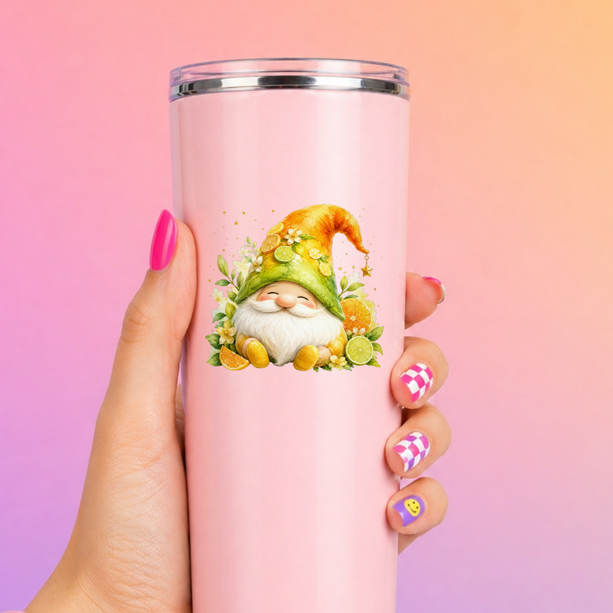 Citrus Gnome With Orange Slices UV DTF sticker applied to a tall pink tumbler on a pink and orange background