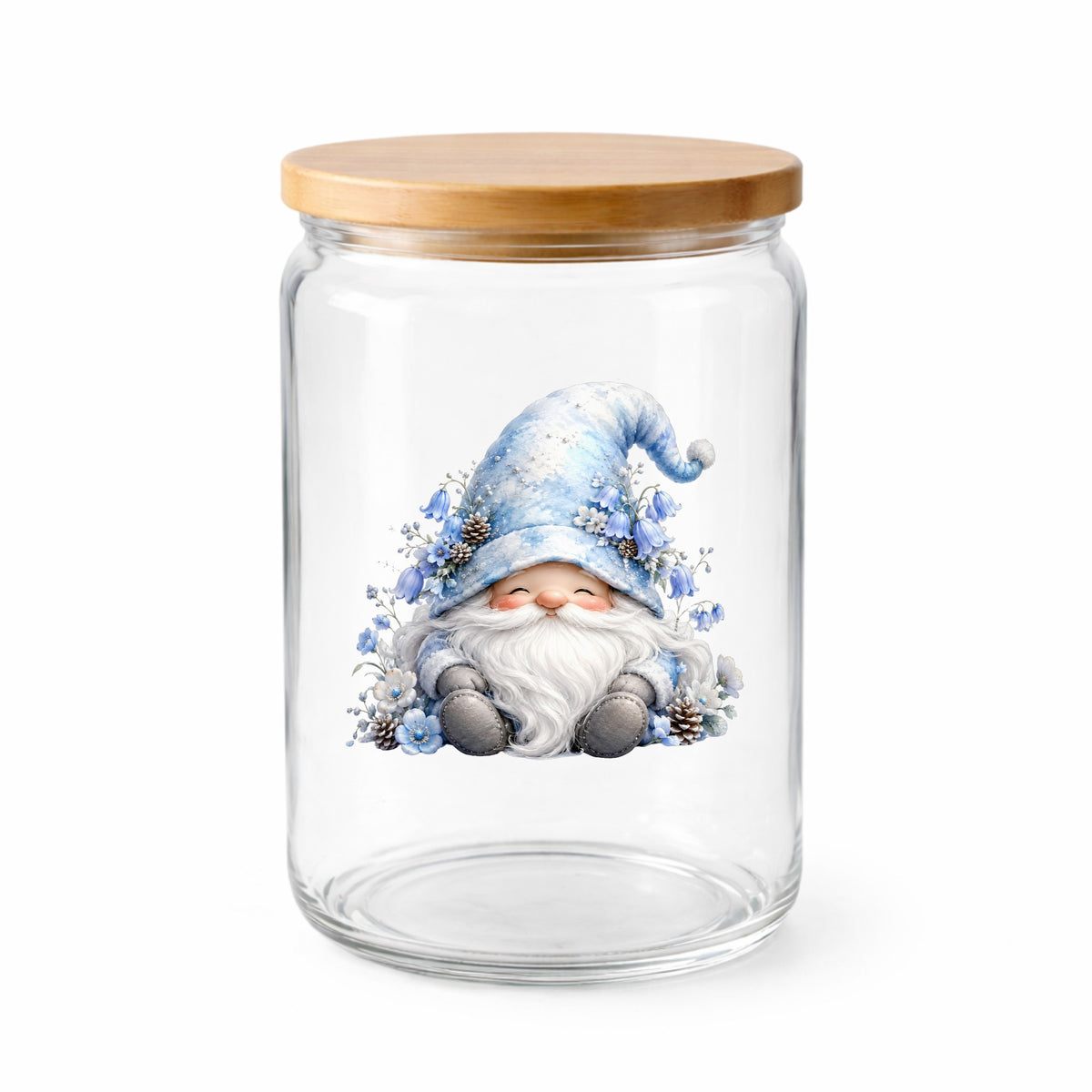 Winter Gnome With Pinecones UV DTF sticker applied to a clear glass jar with a wooden lid