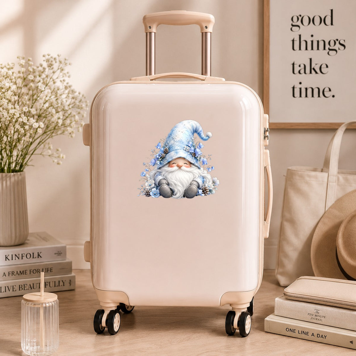 Winter Gnome With Pinecones UV DTF sticker applied to a cream carry-on suitcase