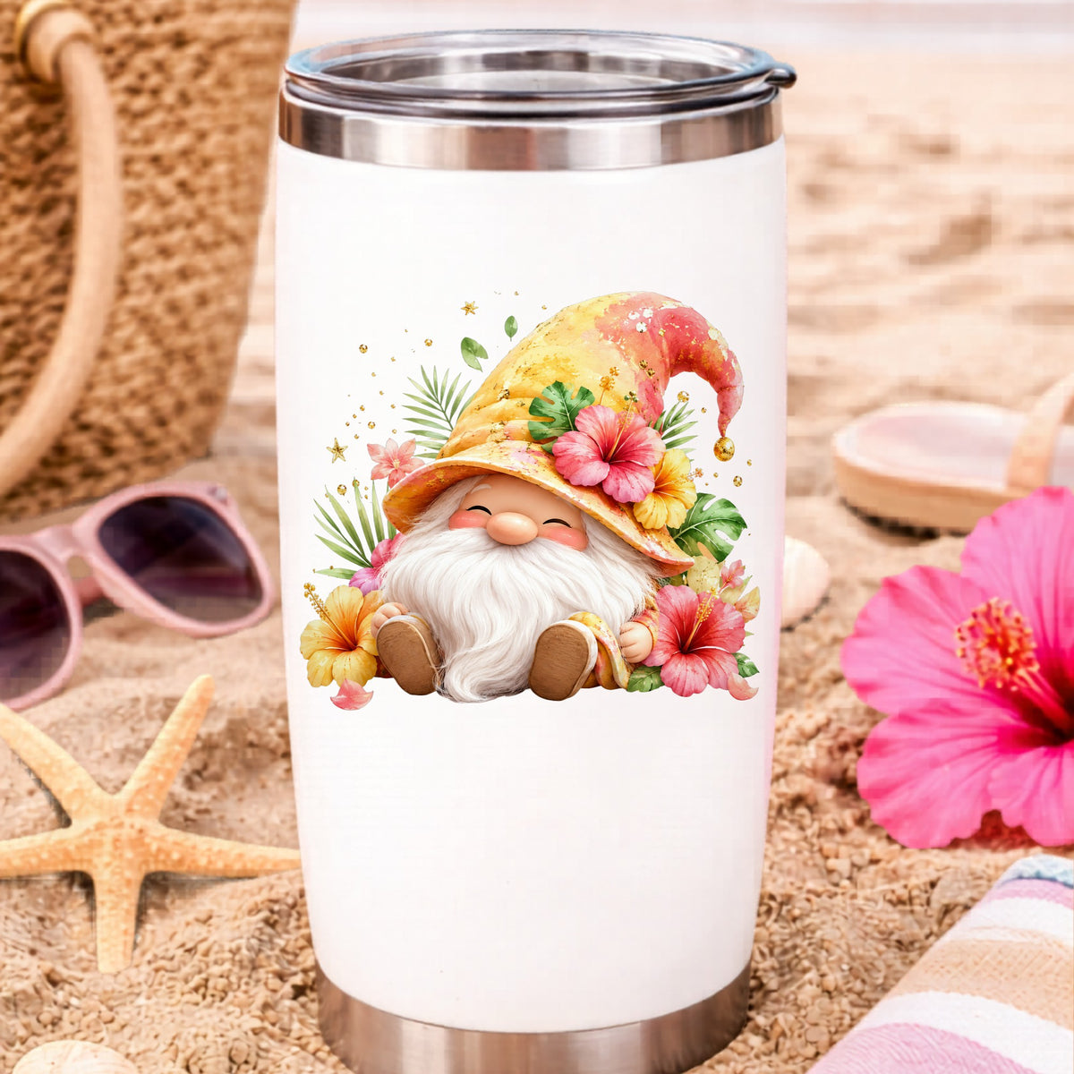 Tropical Hibiscus Gnome UV DTF sticker applied to a white travel tumbler on beach sand